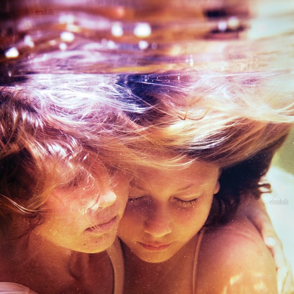 Water Underwater portraits blue colorful sun rays children couple breast 