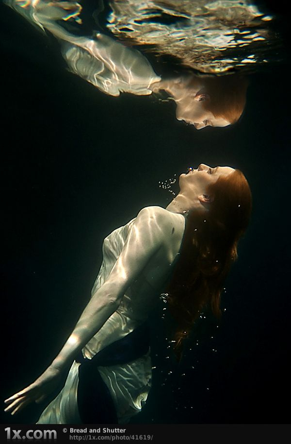 Free female under water conceptual photography