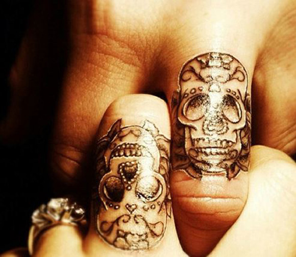 Couple tattoo of skulls